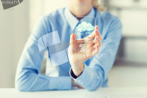 Image of close up of woman with weather app on smartphone