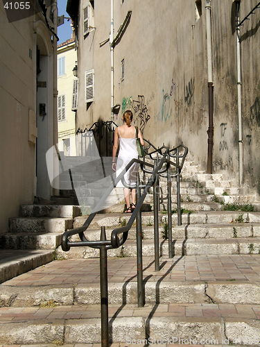 Image of Woman climbing stairs