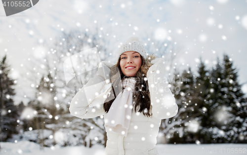 Image of happy woman outdoors in winter