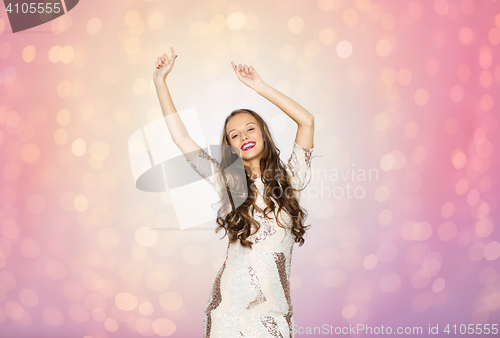 Image of happy young woman or teen girl dancing at party