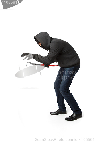 Image of Crouching burglar with master key