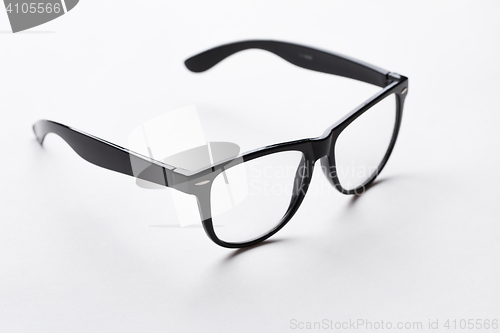 Image of Black-rimmed glasses on white background