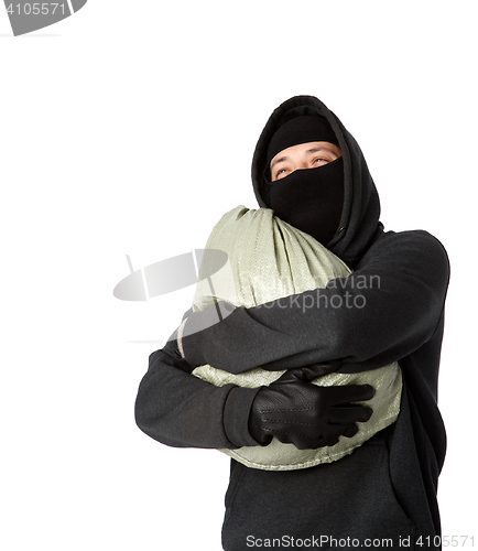 Image of Robber hugging bag of money