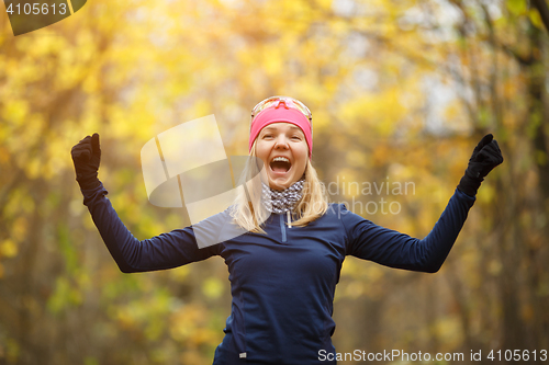 Image of Girl in sportswear doing exercises