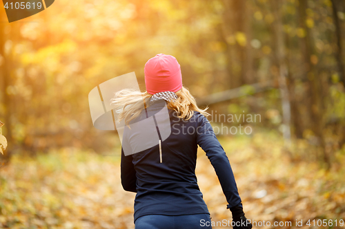 Image of Blonde sportswoman runs in morning