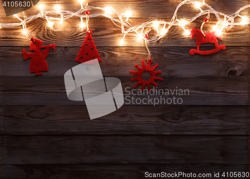 Image of Felt toys on wooden background