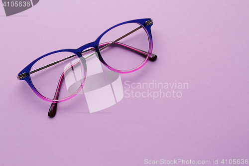 Image of Multi-colored glasses in purple background