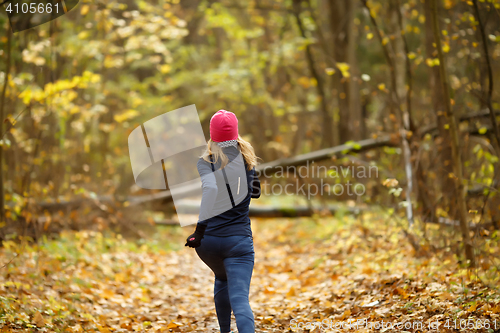 Image of Blonde girl running in morning