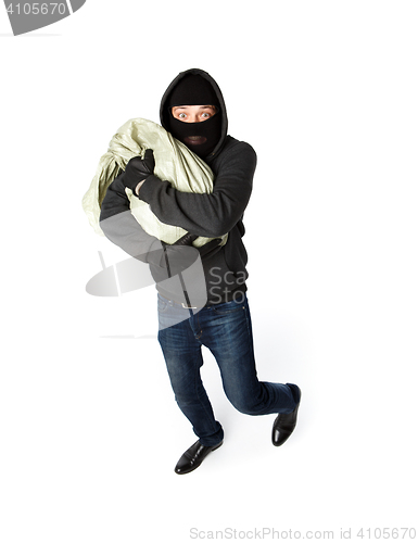 Image of Robber hugging sack of money