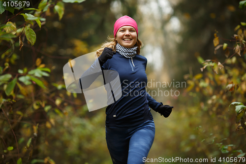 Image of Blonde woman running in morning