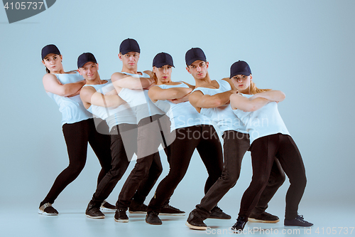 Image of Group of men and women dancing hip hop choreography
