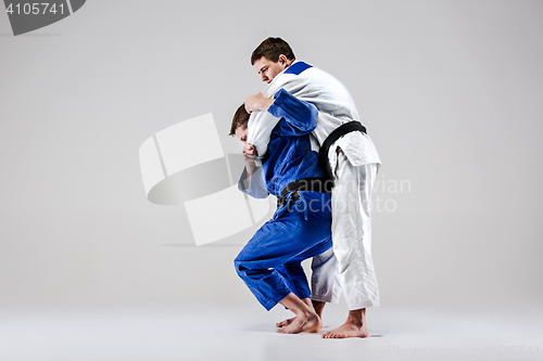 Image of The two judokas fighters fighting men