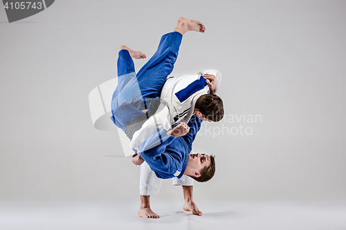 Image of The two judokas fighters fighting men