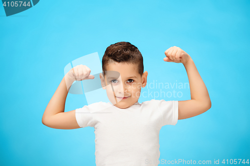 Image of Beauty smiling sport child boy showing his biceps