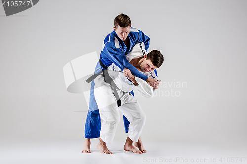 Image of The two judokas fighters fighting men