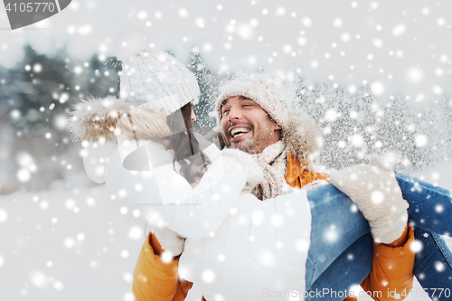 Image of happy couple outdoors in winter