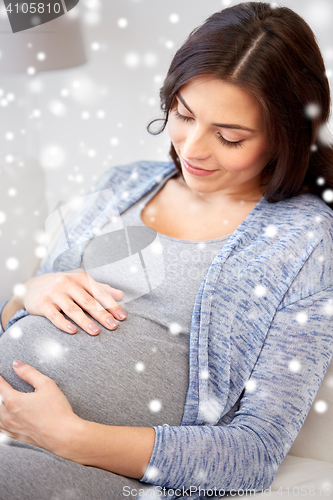 Image of close up of happy pregnant woman at home