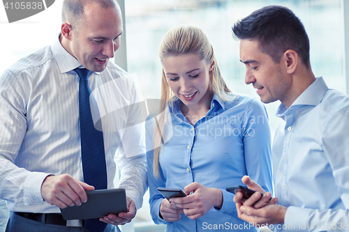 Image of business people with tablet pc and smartphones