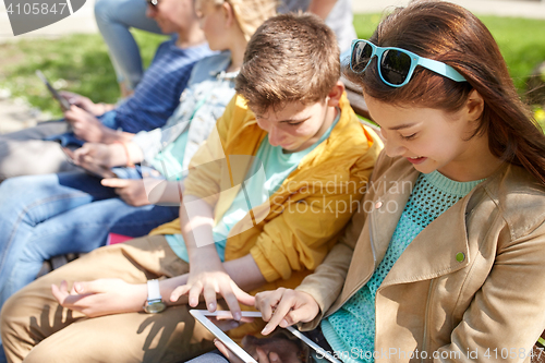 Image of group of students with tablet pc at school yard