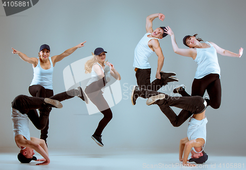 Image of Group of men and women dancing hip hop choreography