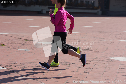 Image of young  couple jogging