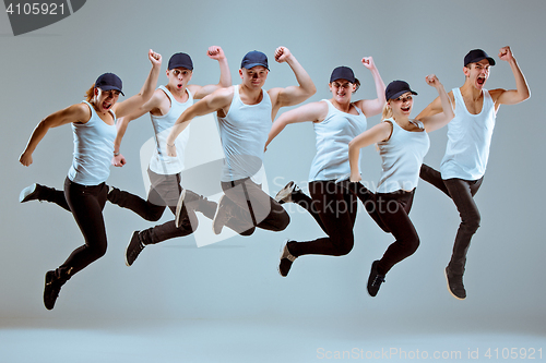 Image of Group of men and women dancing hip hop choreography