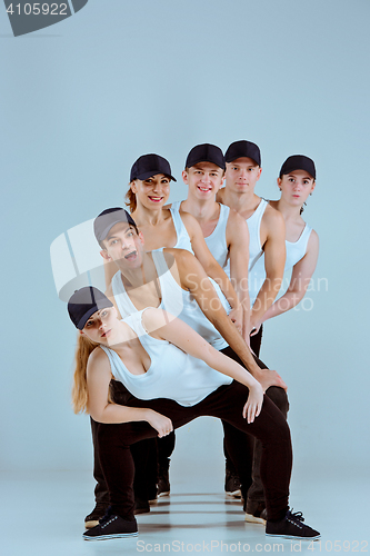 Image of Group of men and women dancing hip hop choreography