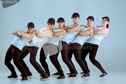Image of Group of men and women dancing hip hop choreography