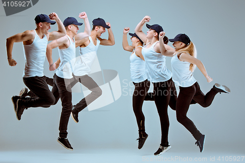 Image of Group of men and women dancing hip hop choreography