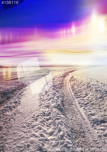 Image of Snow covered road and polar lights