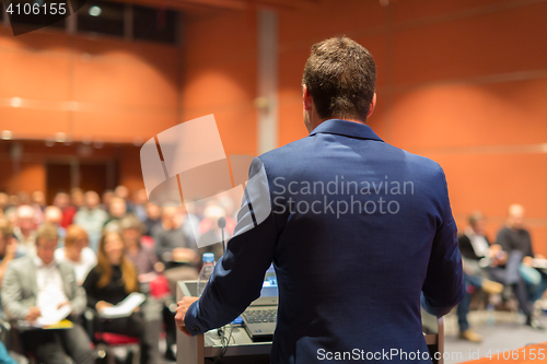 Image of Speaker at Business Conference and Presentation.