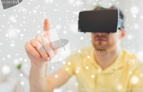 Image of young man in virtual reality headset or 3d glasses