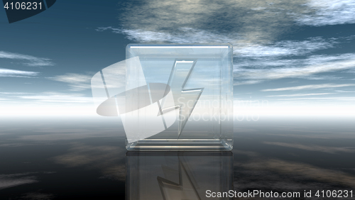 Image of flash symbol in glass cube under cloudy sky - 3d rendering