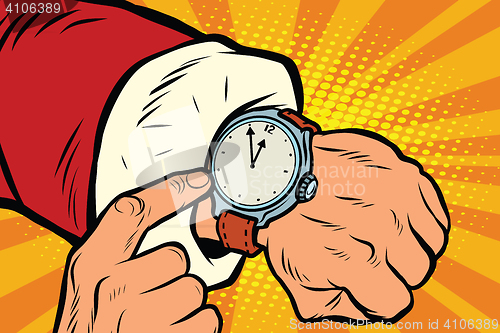 Image of Santa Claus shows the clock, nearly midnight