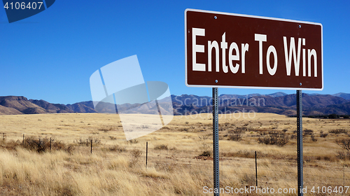 Image of Enter To Win brown road sign