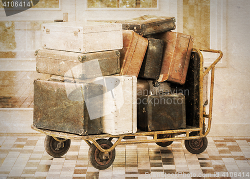 Image of Trolley full of old luggage