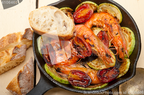 Image of roasted shrimps with zucchini and tomatoes