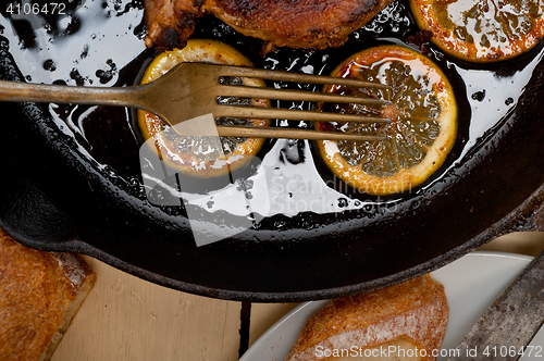 Image of pork chop seared on iron skillet