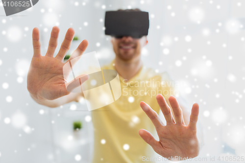 Image of young man in virtual reality headset or 3d glasses