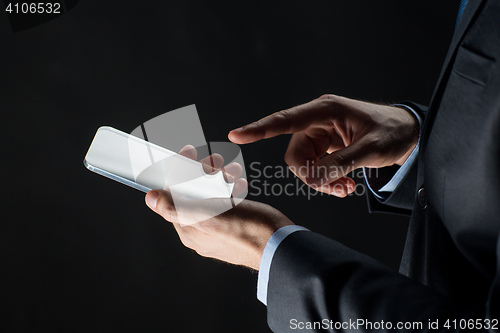 Image of close up of businessman with glass smartphone