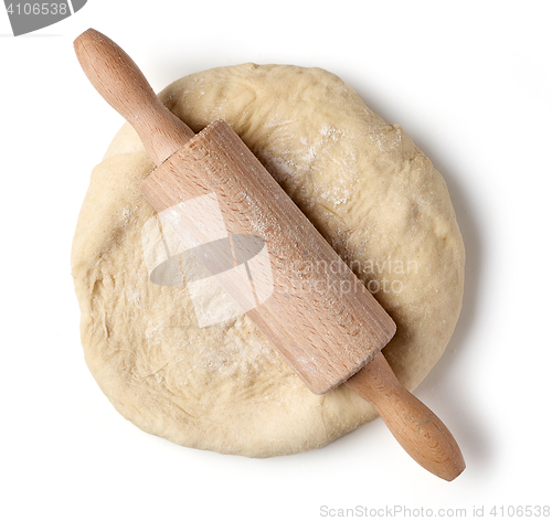 Image of fresh raw dough and rolling pin