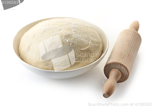 Image of bowl of fresh dough and rolling pin