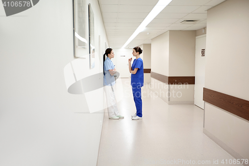 Image of female doctors or nurses talking at hospital