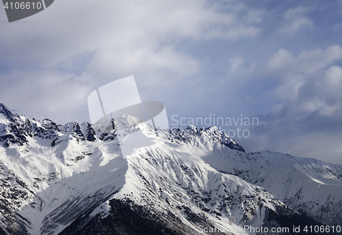 Image of Snow mountain and gray sky at winter evening