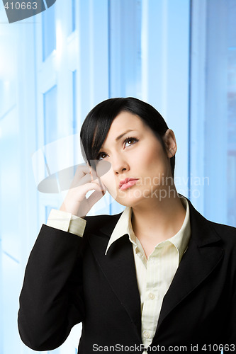 Image of Thinking businesswoman