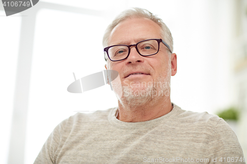 Image of close up of smiling senior man in glasses