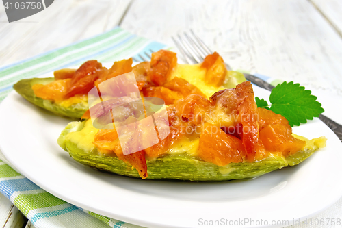 Image of Courgettes in spicy sauce with dried apricots on towel