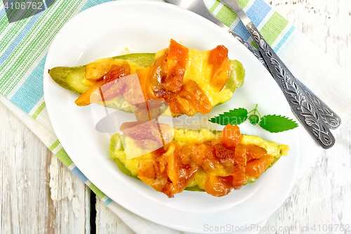 Image of Courgettes in spicy sauce on board top