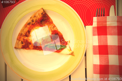 Image of slice of pizza Margherita on a plate