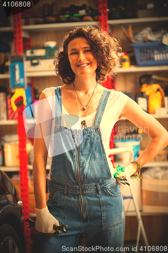 Image of car mechanic woman in repair shop